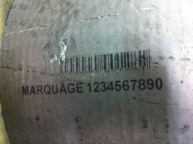Identification and barcode marking on raw aluminium billet with difficult surface.